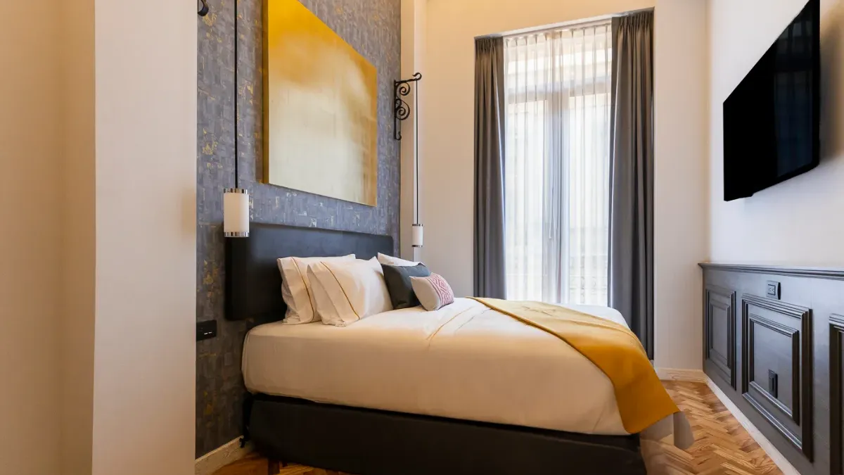 Cama de la Habitación Suite Queen Filomeno Mata en el Hotel Bellas Artes. Es tamaño queen size y tiene mucho espacio.