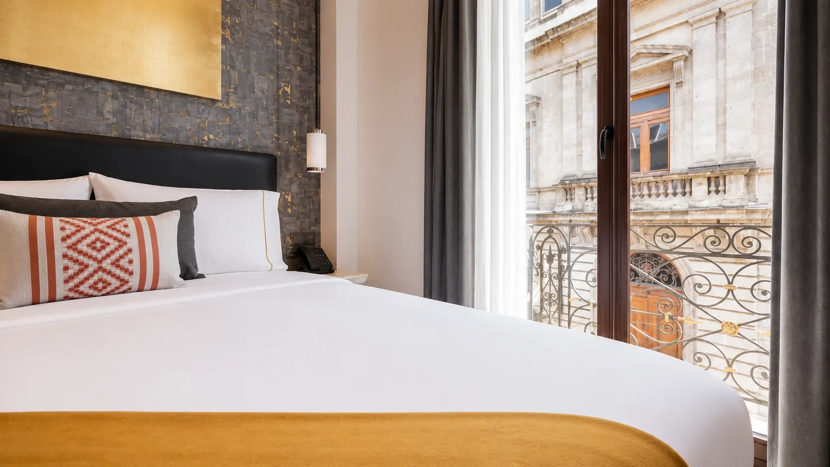 View of Filomeno Mata Street from the Filomeno Mata Queen Suite at Hotel Bellas Artes. The balcony is visible.