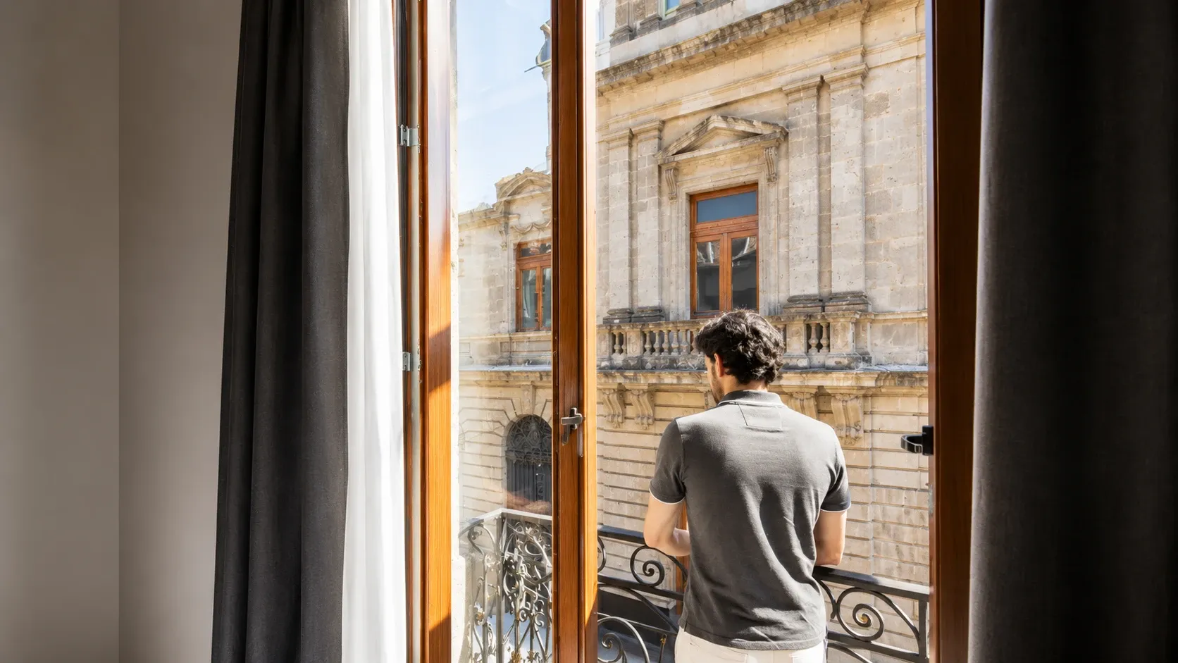 View from the Filomeno Mata Queen Suite at Hotel Bellas Artes. A model is in the photograph.