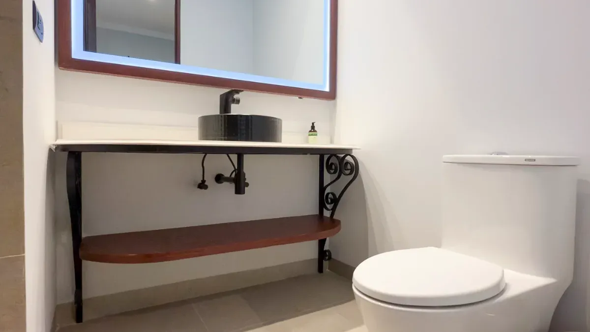 Bathroom of the Interior Queen Suite at Hotel Bellas Artes. Sink and toilet.